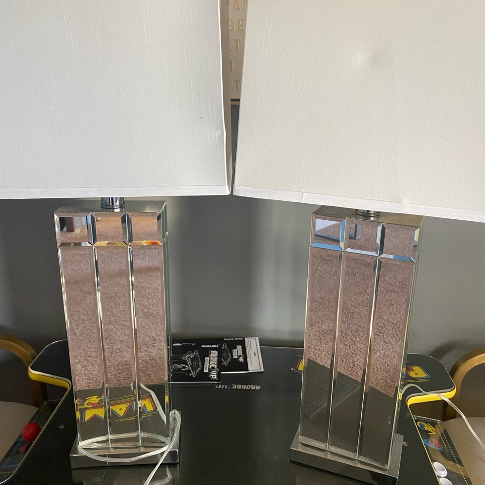 A pair of mirrored base lamps